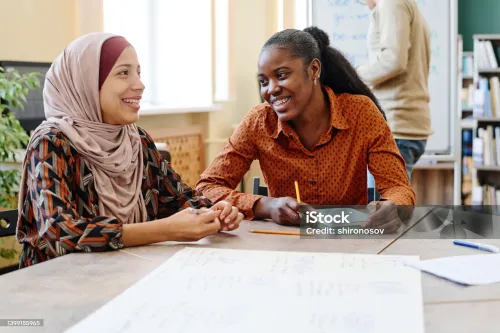 Two women at a table talking