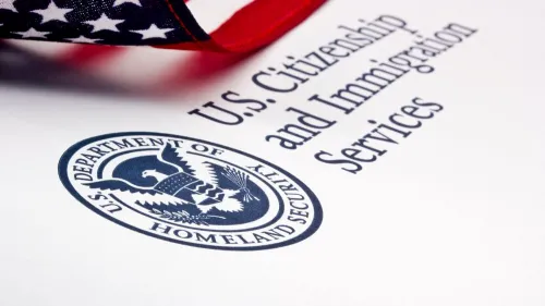U.S. Citizenship and Immigration Services (USCIS) logo with U.S. flag