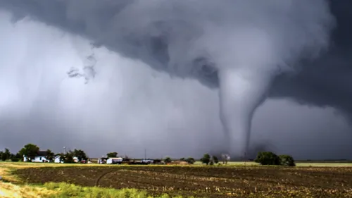 Tornado moving across a country landscape