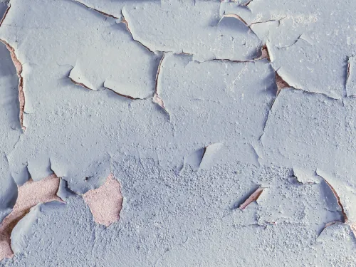A photograph of peeling, chipped paint.
