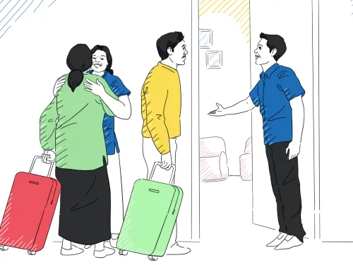 A man and a woman welcome newcomers to their home. 