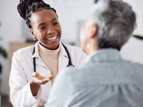 A doctor speaking with their patient