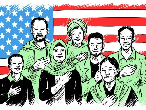 Newcomers standing in front of a US flag