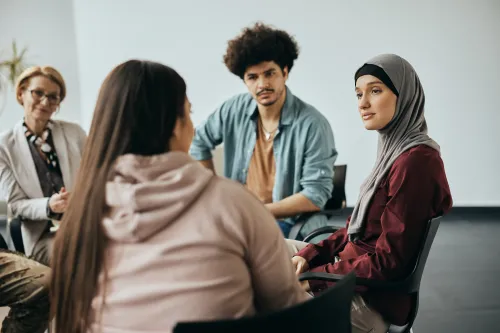 Photo of a group of people in a mental health support group.