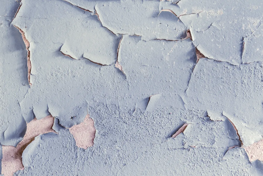 A photograph of peeling, chipped paint.